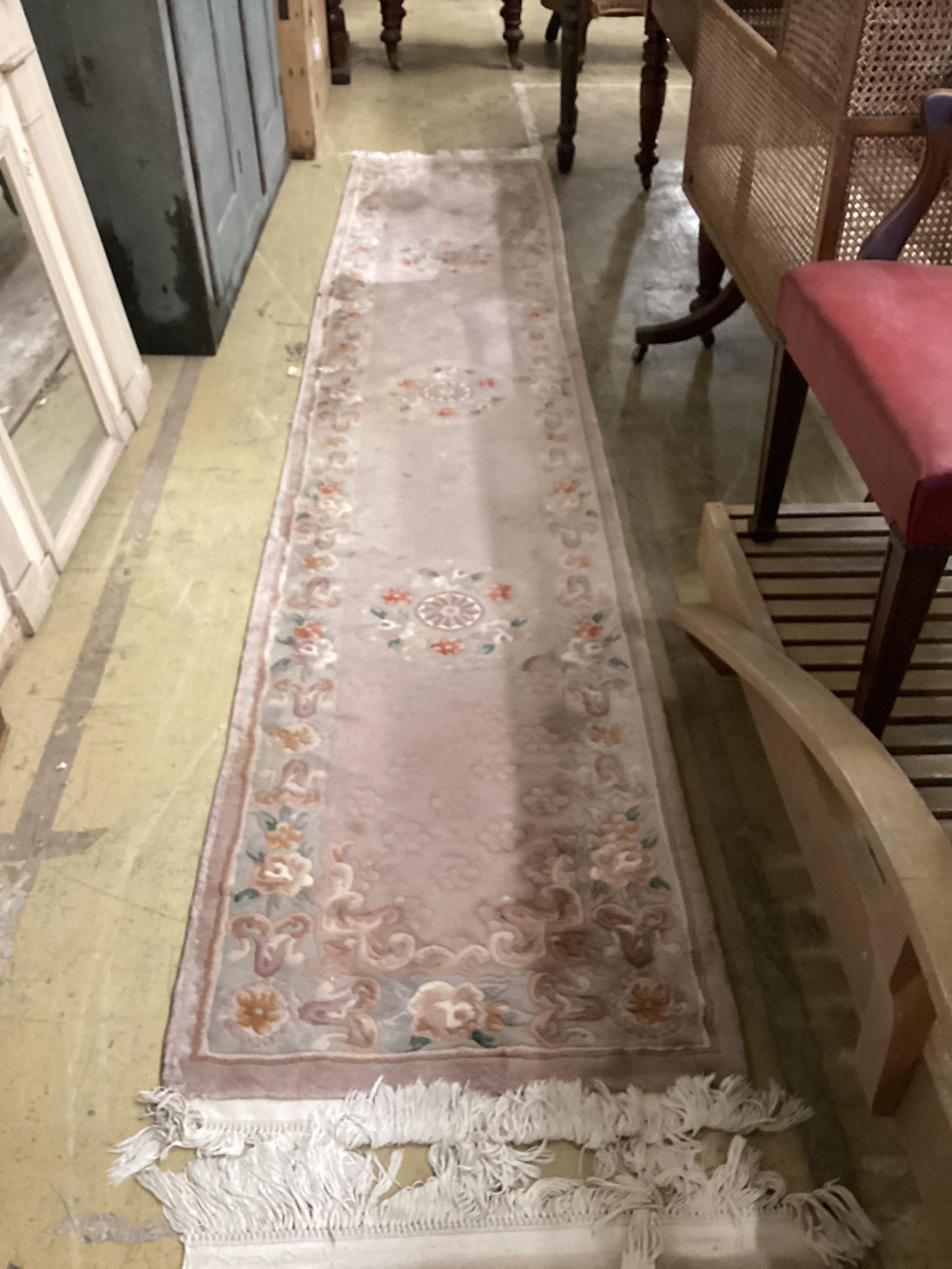 Two Chinese fawn ground floral runners, both 360cm x 70cm.